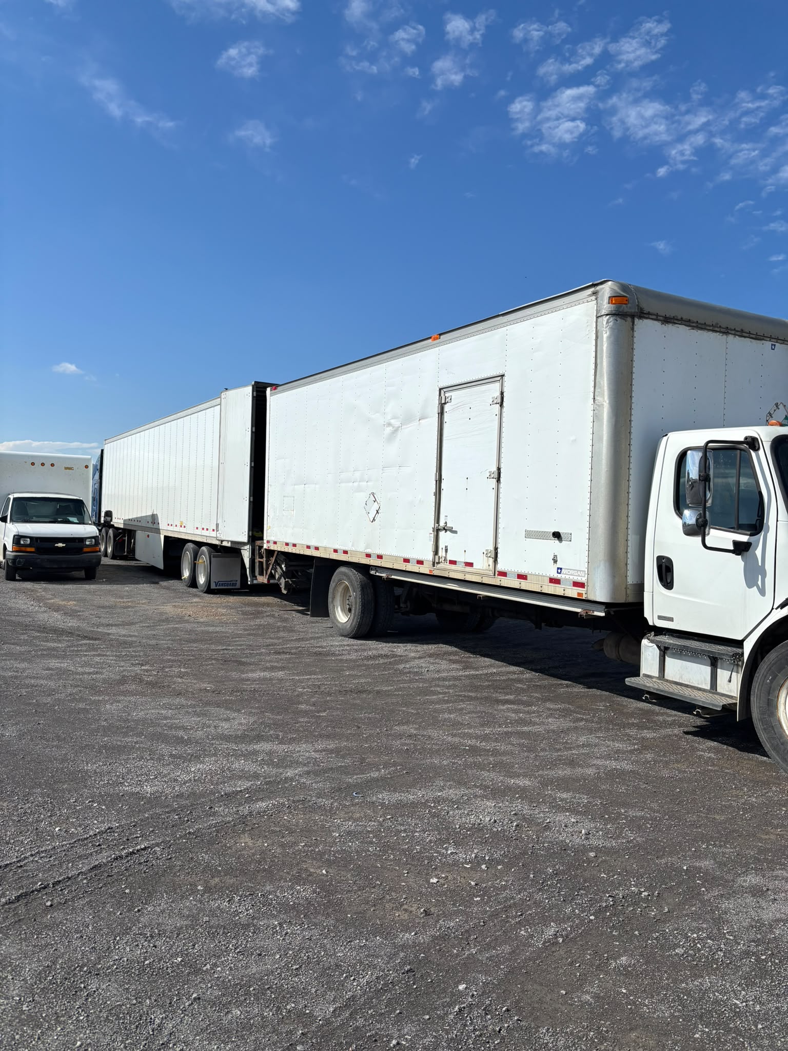 Experienced movers carefully transporting heavy furniture